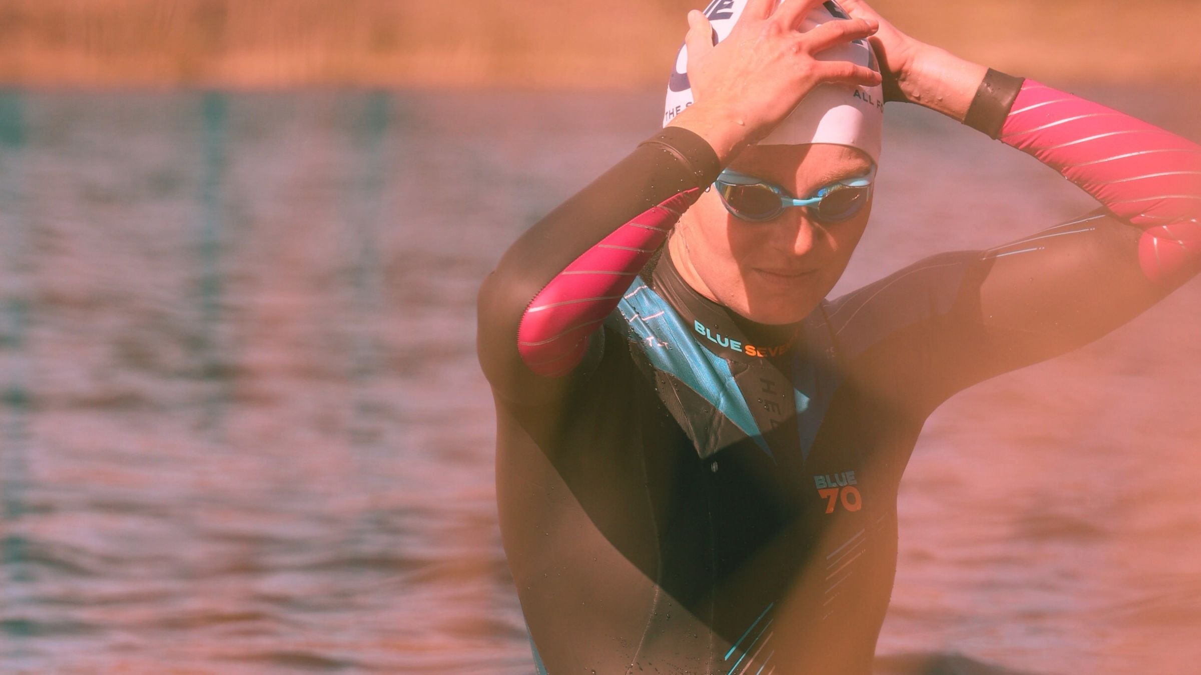 Ali Brauer, an overtraining triathlete, in a wetsuit for an open water swim.