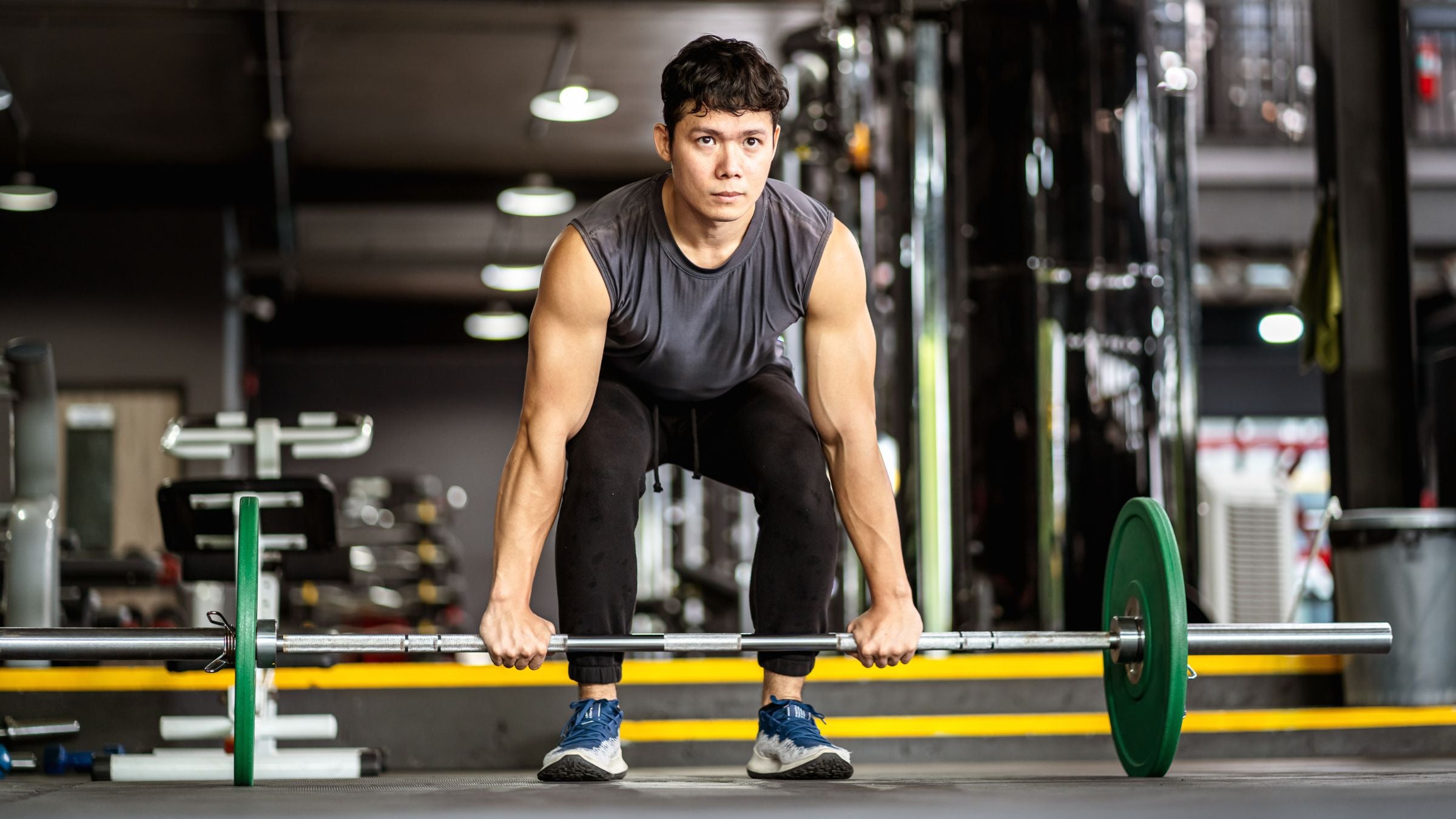 A man demonstrates mind muscle connection while lifting weights