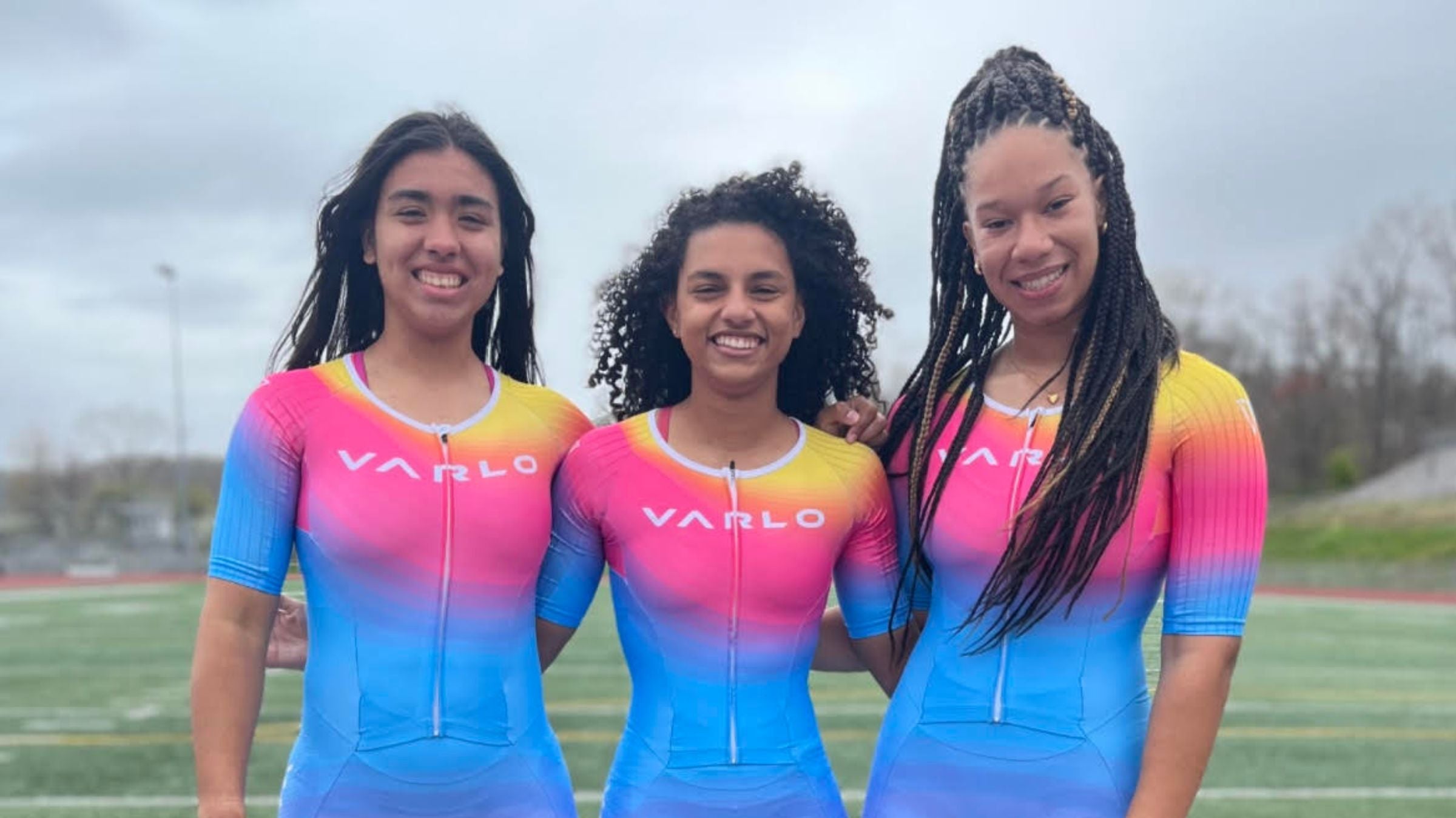 The Naugatuck High School Triathlon team pose for a photo in their tri suits. The team is looking to increase diversity in triathlon.