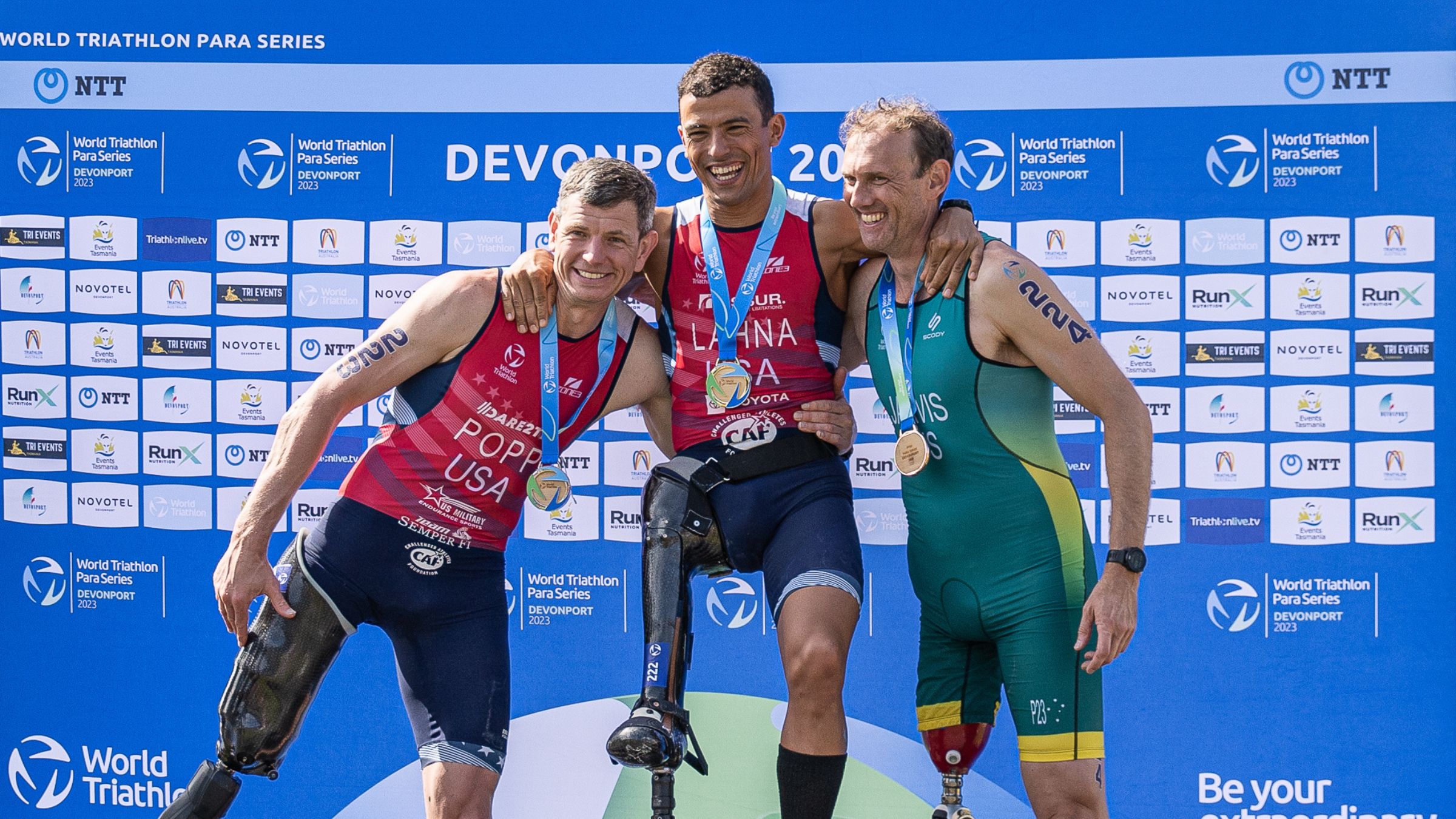 Mohamed Lahna stands atop the podium for paratriathlon at World Triathlon Para Series Devonport.