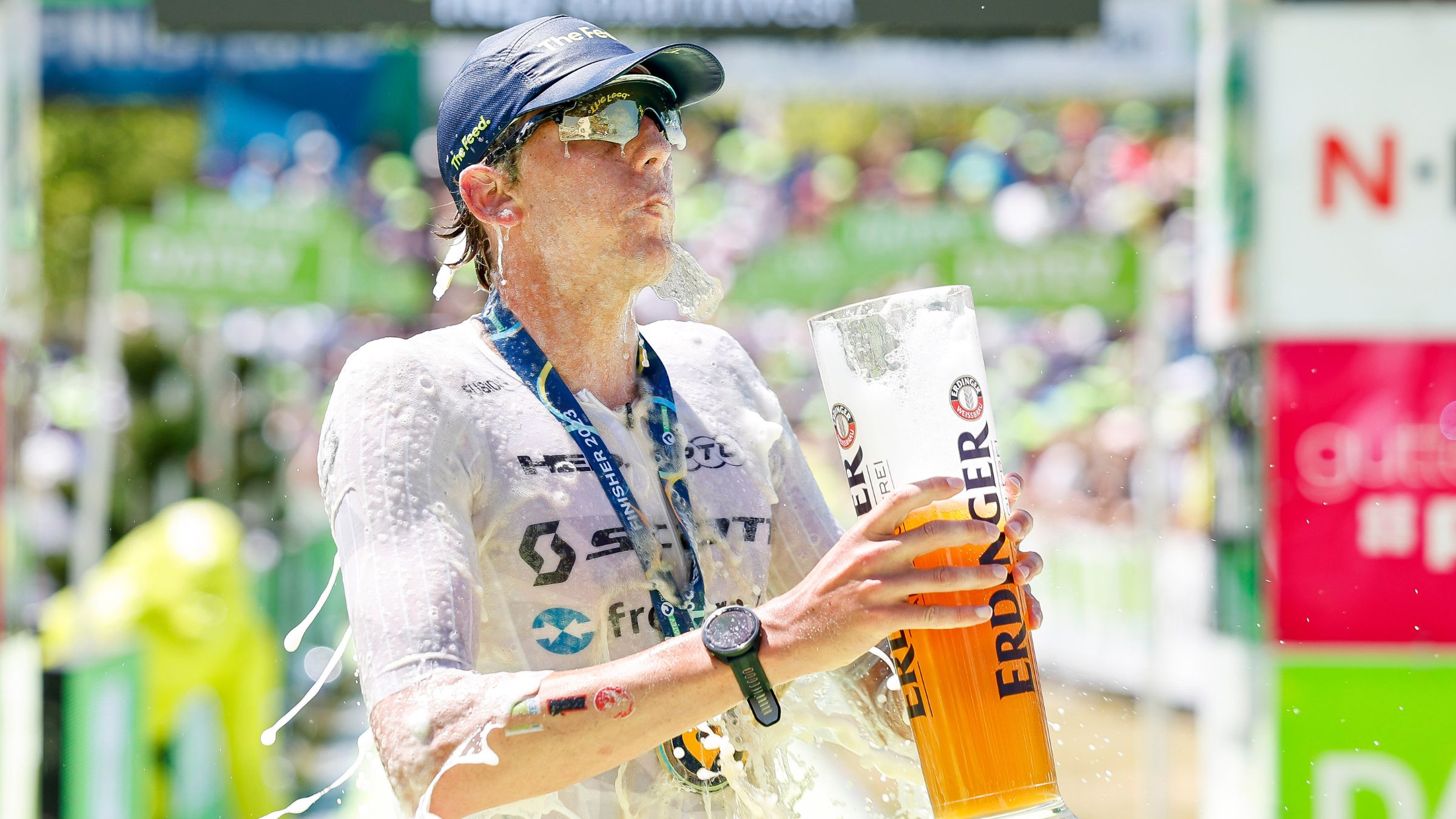 Denmark's Magnus Ditlev takes a beer shower after winning Challenge Roth with a record-setting time.