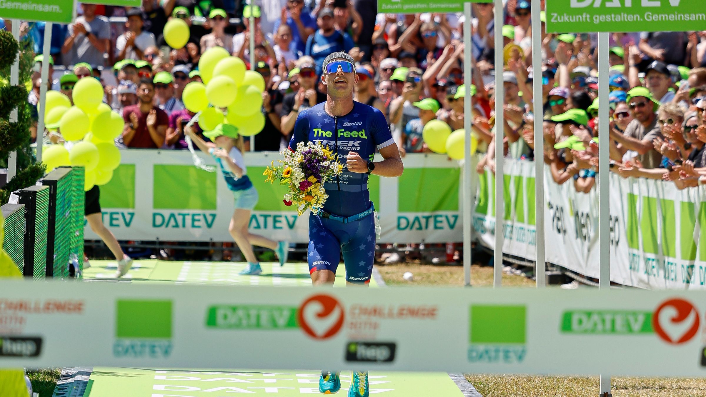 Ben Kanute in the finisher's chute at Challenge Roth 2023, where he placed third and set a record for fastest American at the full iron distance.