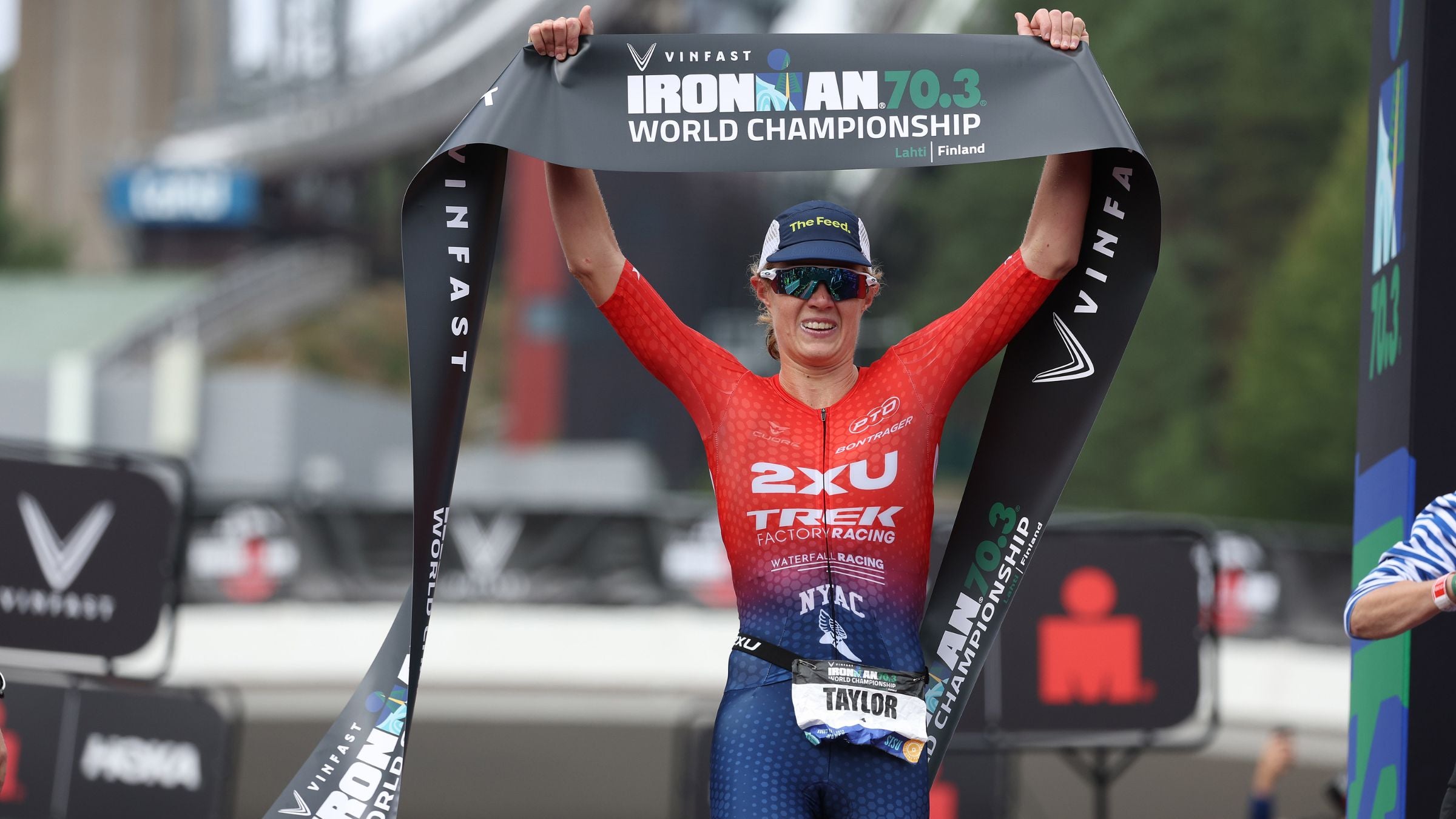 Taylor Knibb celebrates winning the 2023 Ironman World Championship. The American will attempt a hat trick of 70.3 World titles on the 2024 Ironman World Championship livestream December 14-15.