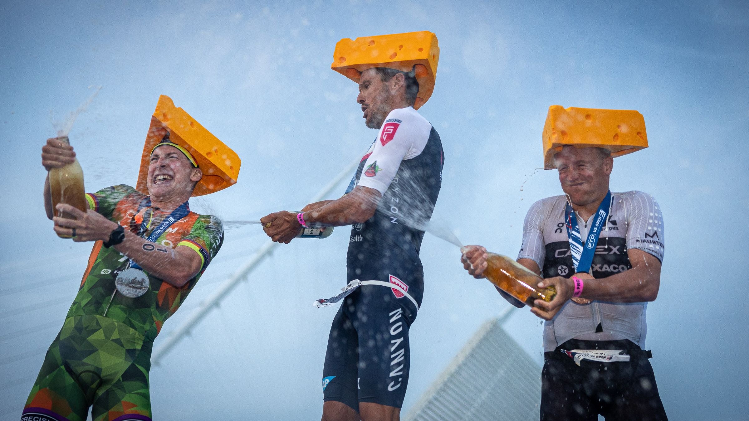L-R: Jason West, Jan Frodeno, and Kristian Blummenfelt celebrate their podium finishes at the PTO U.S. Open in Milwaukee, Wisconsin.