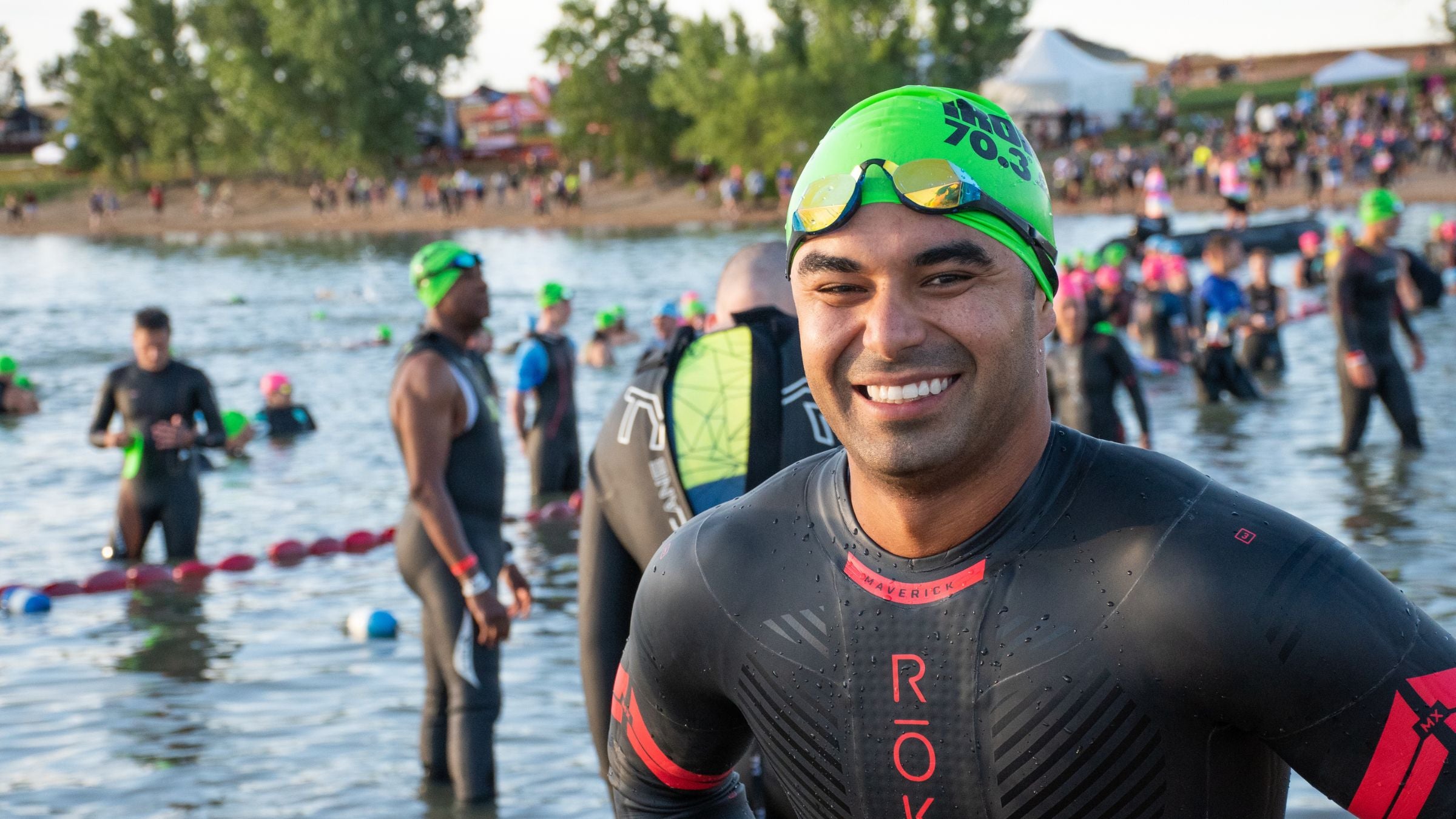 A triathlete smiles after using Triathlete's Super Simple 70.3 Training Plan to train for his half-Ironman triahtlon.