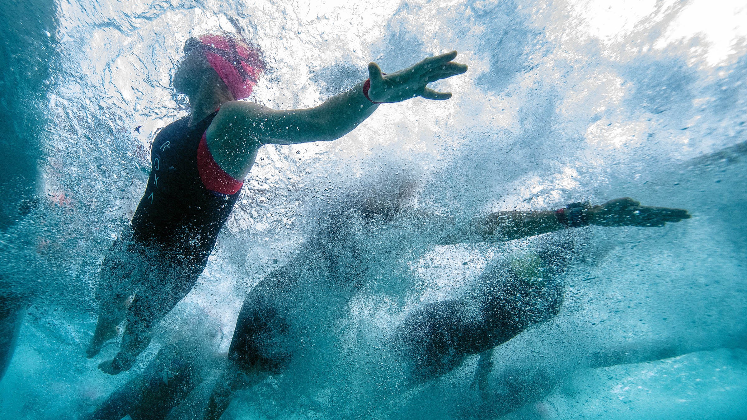 Swimmers drafting in a pack