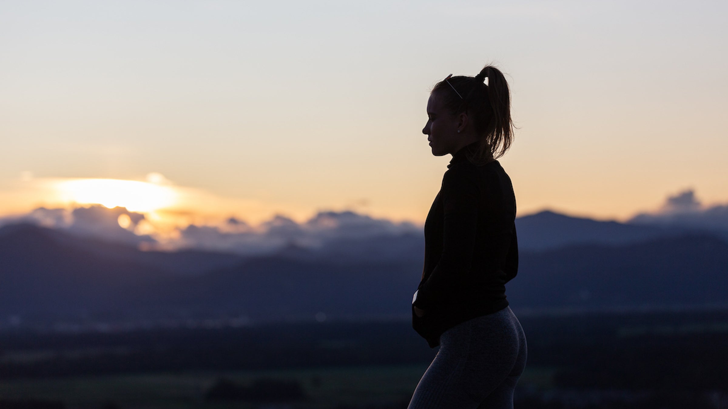Woman watching sunset