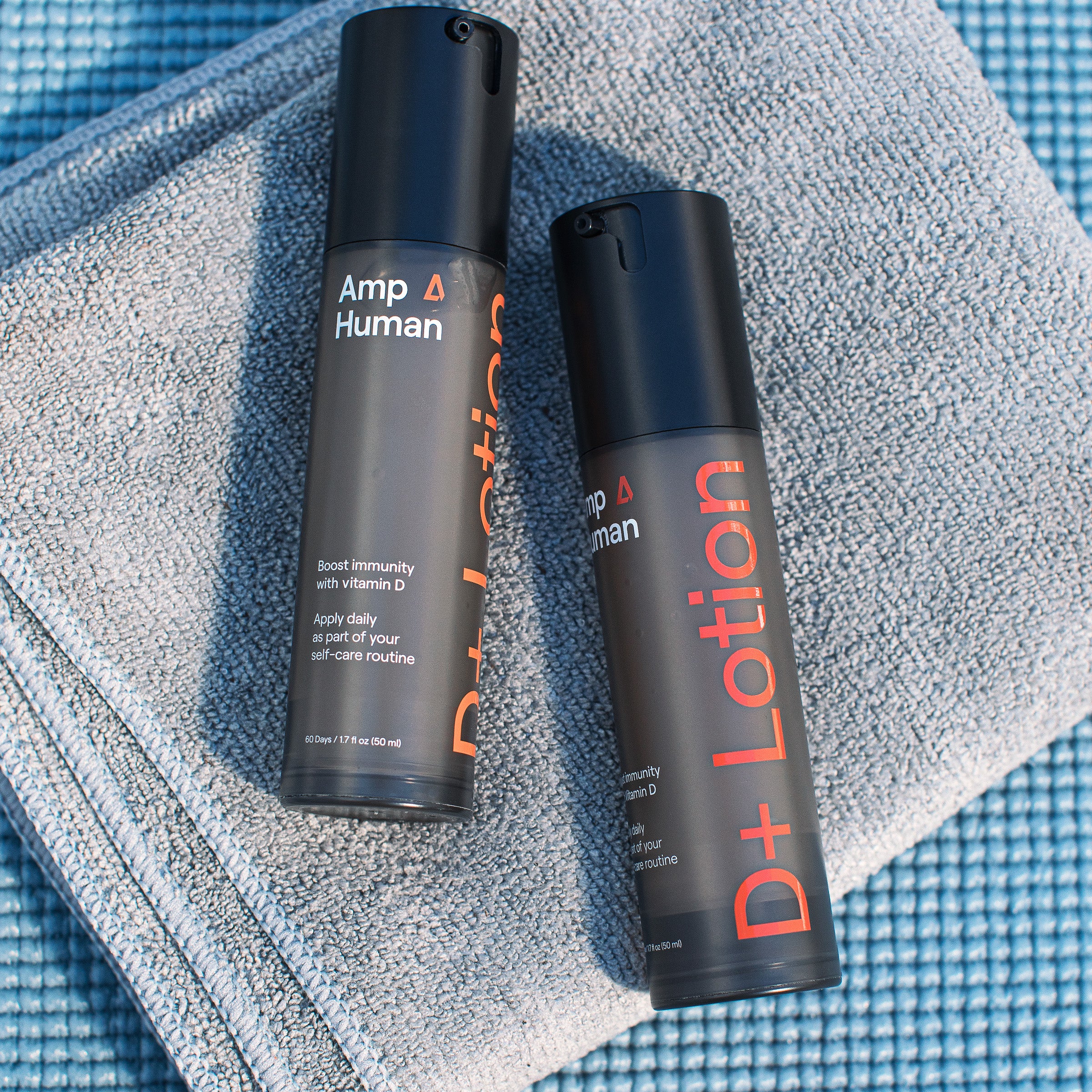 Close-up of D+ Lotion bottles